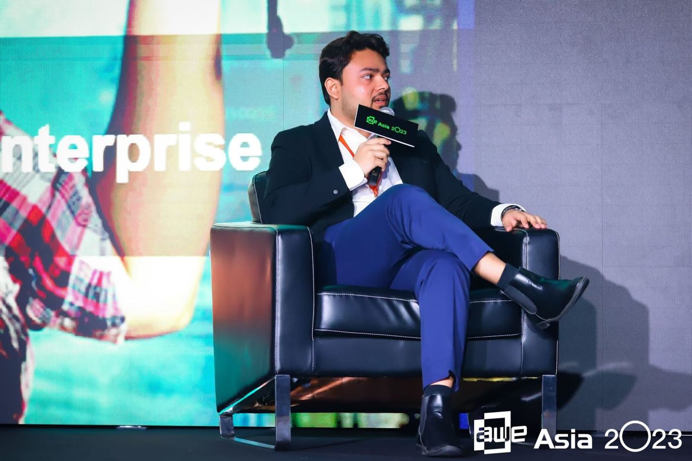 Sanan Goyal speaking as a panelist on stage at AWE Asia 2023, Singapore